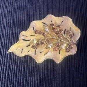 Vintage Gold-Tone Leaf Brooch with light green and topaz colored Crystals